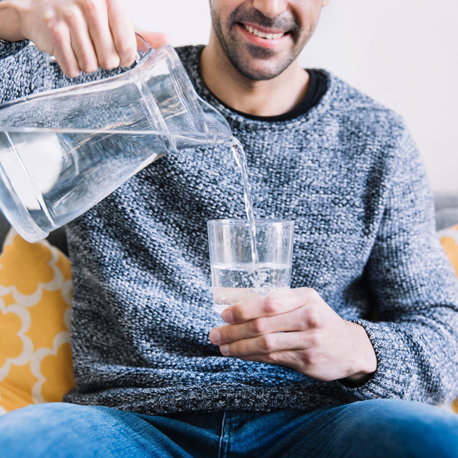 Home crop man sofa pouring water